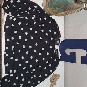 A black and white polka dot cropped formal shirt.